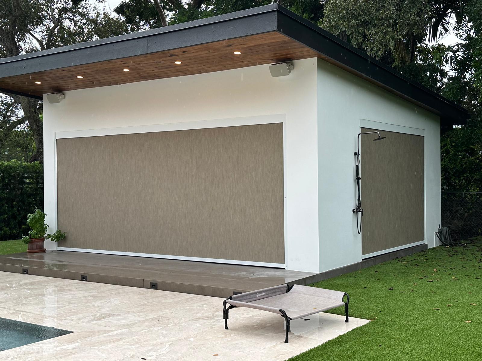 Outdoor screen shades installed on a pool house in Miami